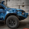 Передний силовой бампер для Mitsubishi L200 (VI c 2019 г., с противотуманными фарами, защитной дугой и балкой)